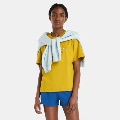 نيو بالانس تيشيرت آثليتكس ليجاسي جرافيك للنساء برتقالي